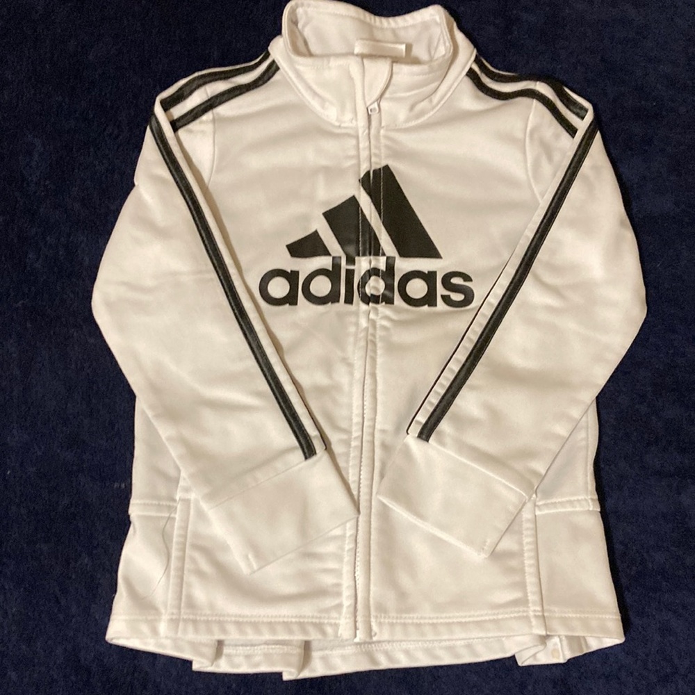 White and black Adidas sweatshirt with ruffle bottom on back